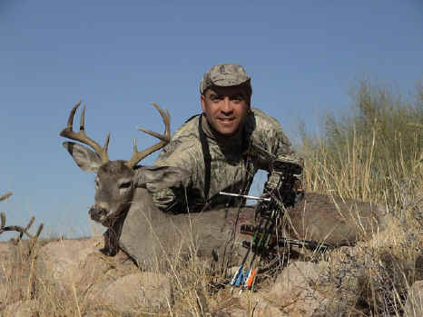 AGH Guide Eliot Anderson with a great bow kill coues buck.