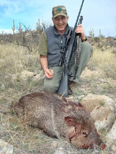 Javelina with a rifle