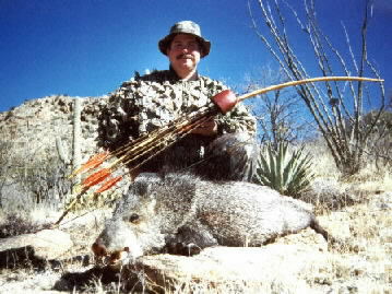 Dan Talkington with a javelina taken with a Howard Hill Longbow.