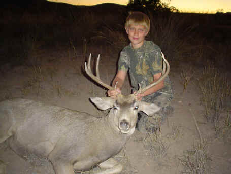 Bryce with his first mule deer buck.
