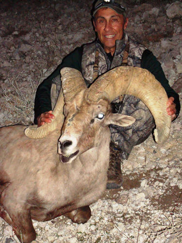 Claude Sanchez with a desert bighorn sheep