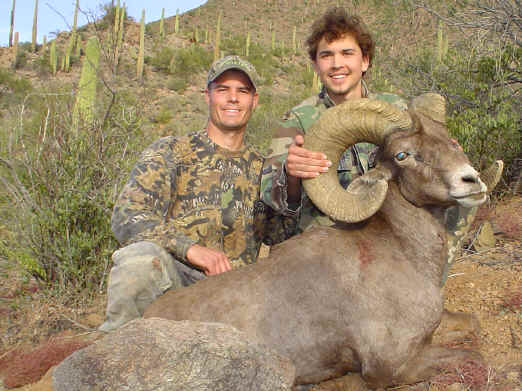 Chase Phillips and Pat Feldt with a desert Ram